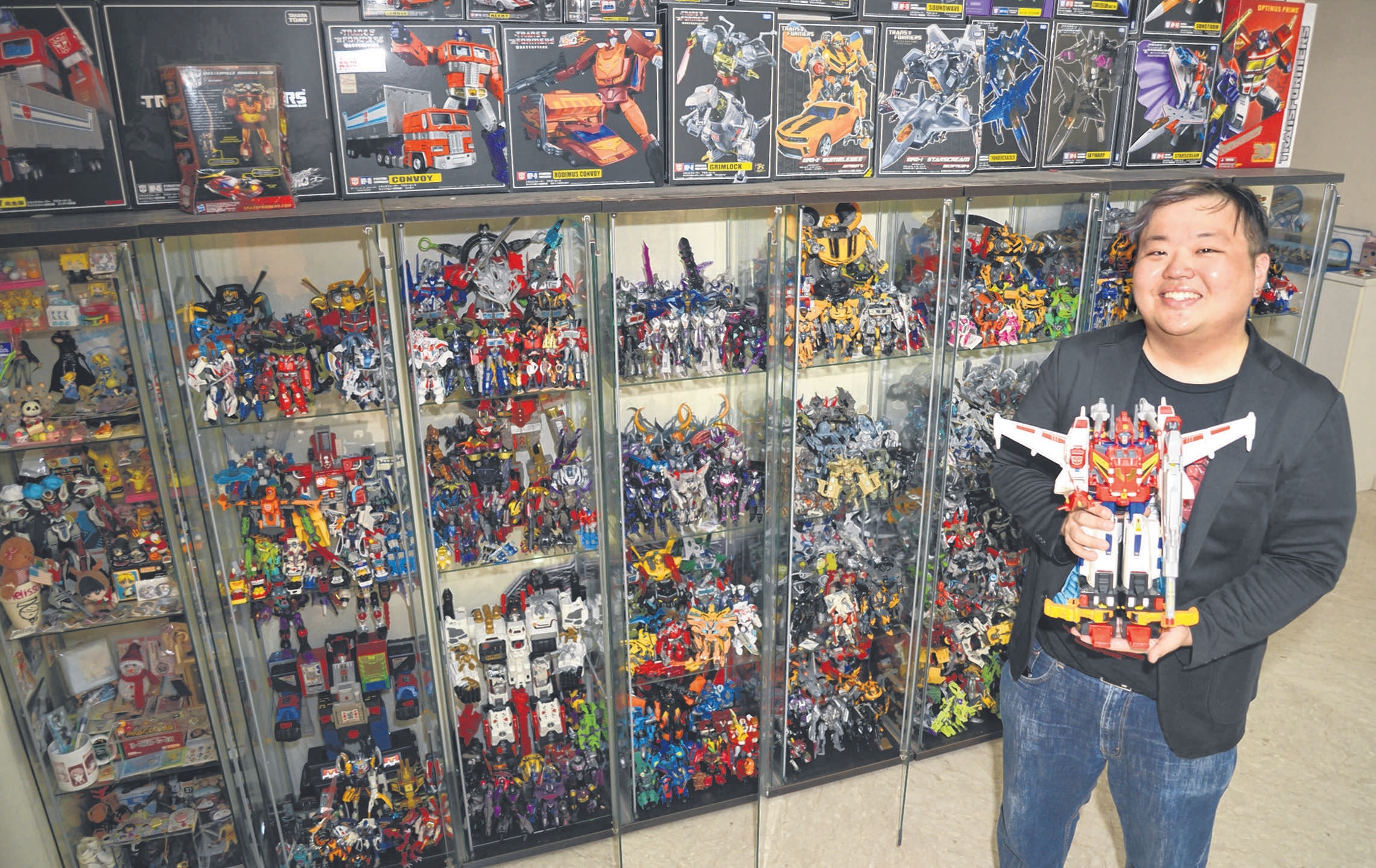 RETIREE GOH HENG SIANG on his son Marcus Goh (left), 32, who has more than 1,600 Transformers figurines