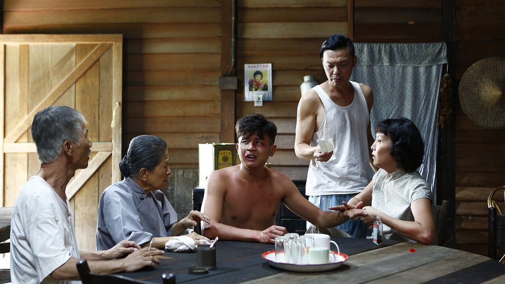 Fourth Uncle (Wang Lei), Ah Ma (Ng Suan Loi), Ah Xi (Benjamin Tan), Ah Kun (Mark Lee) and Zhao Di (Aileen Tan) recuperate after a fight. (Golden Village Pictures)
