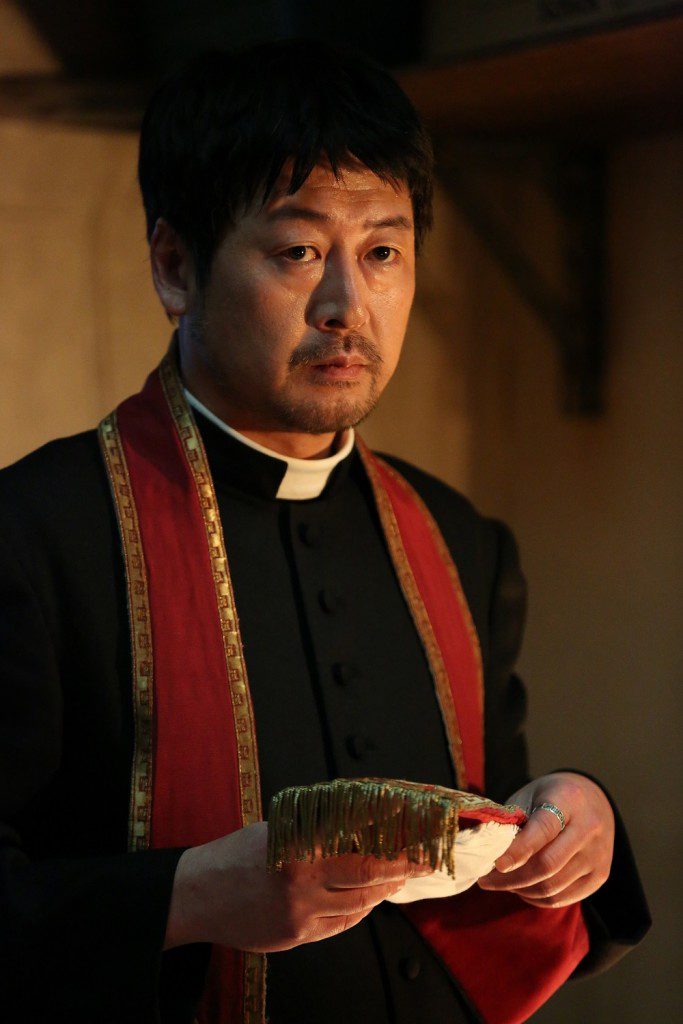 Father Kim (Kim Yoon-seok) at work. (Golden Village Pictures)