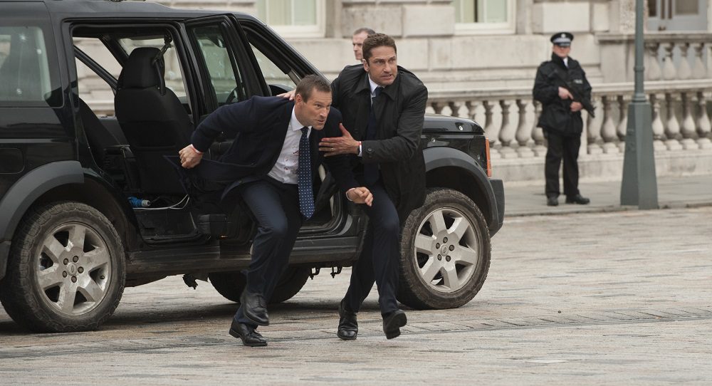 President Benjamin Asher (Aaron Eckhart) is escorted to safety by Mike Banning (Gerard Butler) in "London Has Fallen." (Cathay-Keris Films)