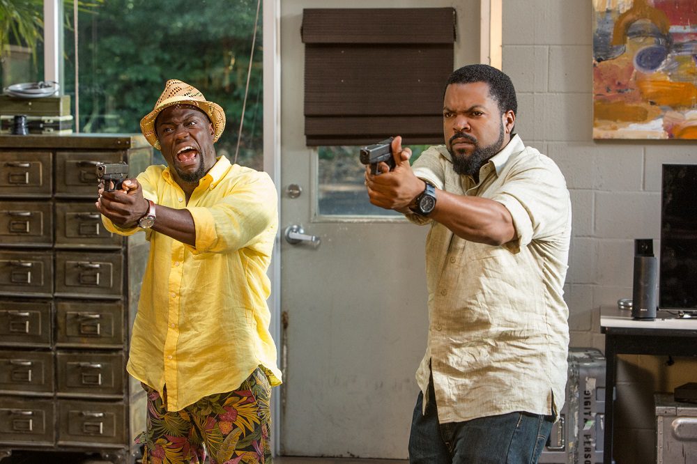 Ben and James raise their guns in "Ride Along 2." (United International Pictures)