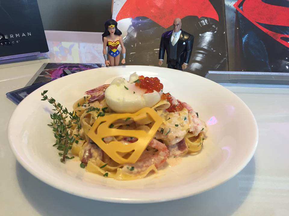 Wonder Woman and Lex Luthor from the Justice League Unlimited series pose with Superman's Pasta Crevettes Carbonara.