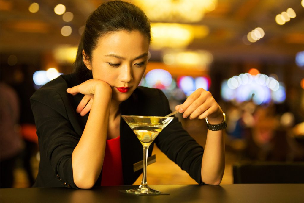 Jiao nurses a drink in "Finding Mr Right 2 (北京遇上西雅图之不二情书)." (Golden Village Pictures)