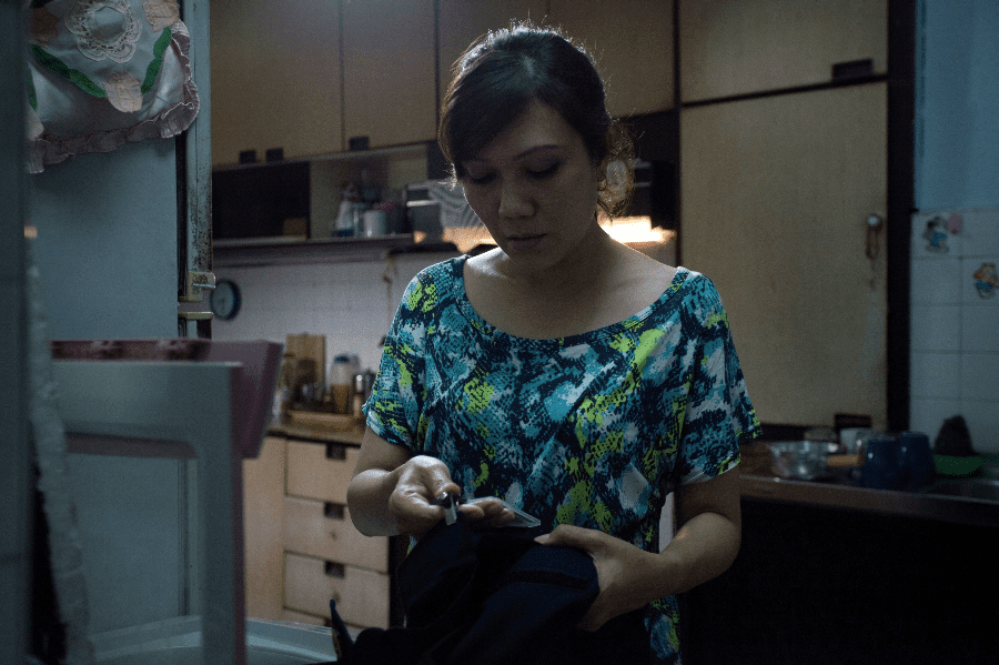 Suhaila (Mastura Ahmad) ponders in "The Apprentice." (Olivia Kwok)