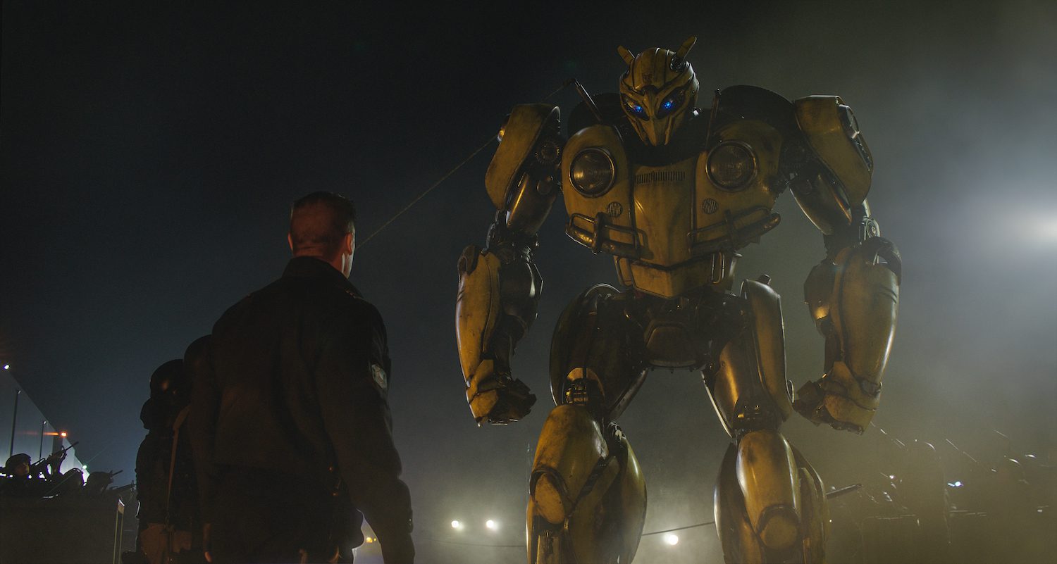 Left to right: John Cena as Agent Burns and Bumblebee in BUMBLEBEE, from Paramount Pictures.