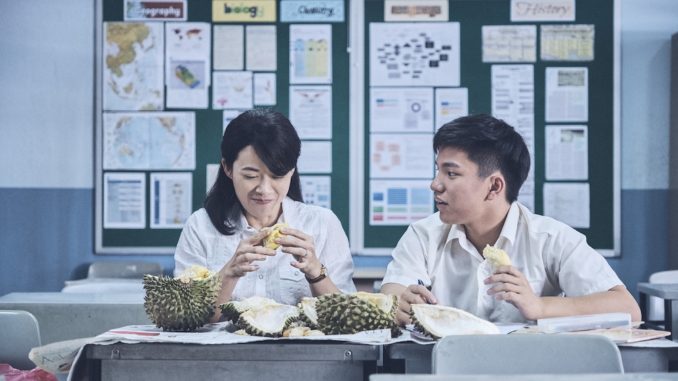 Wei Lun (Koh Jia Ler) and Ling (Yeo Yann Yann) share durians in Wet Season (热带雨). (Golden Village Pictures)
