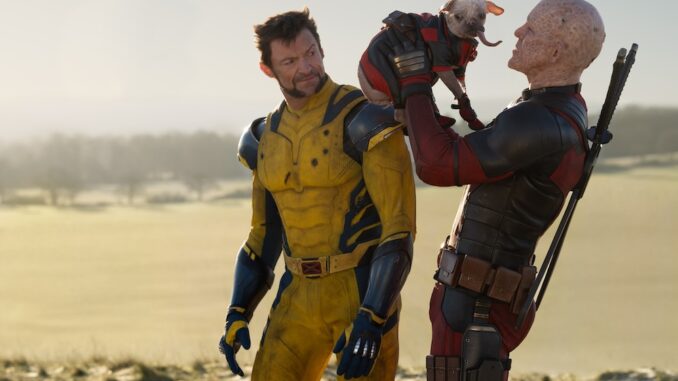 (L-R): Hugh Jackman as Wolverine/Logan, Dogpool, and Ryan Reynolds as Deadpool/Wade Wilson in 20th Century Studios/Marvel Studios' DEADPOOL & WOLVERINE. Photo by Jay Maidment. © 2024 20th Century Studios / © and ™ 2024 MARVEL.