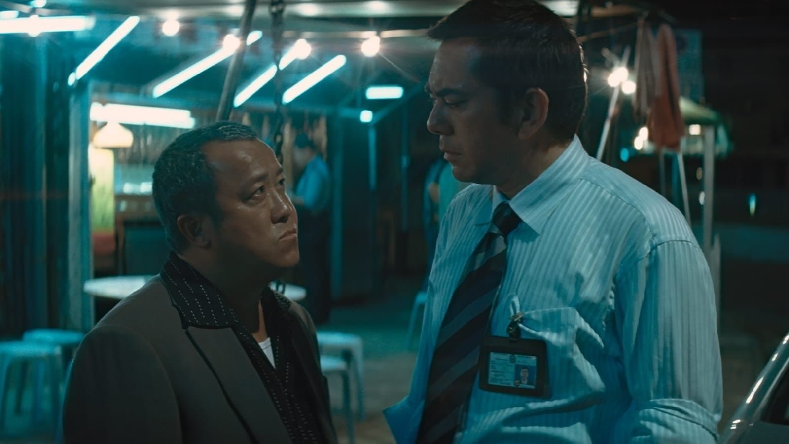 Hon Sam (Eric Tsang) and Wong Chi-shing (Anthony Wong) in Infernal Affairs II. (Credit: Netflix and Media Asia Films)