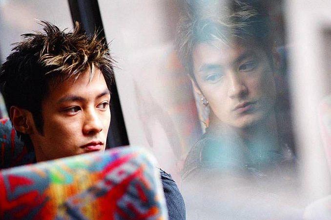 Chan Wing-yan (Shawn Yue) in Infernal Affairs II. (Credit: Netflix and Media Asia Films)